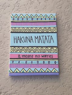 a sign on the wall that says hakuna matata it means no words