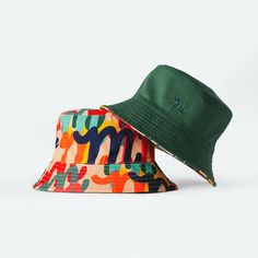 Green/ Million M Pattern Mid-weight reversible Bucket hat with a solid color Side and the MIFLAND Million M's Print on the other side One Size Fits All - Fits from 7-73/4 (Hats Sizes) Green Reversible Sun Hat With Curved Brim, Reversible Bucket Hat For Outdoor, Green Reversible Bucket Hat For Outdoor, Green Reversible Short Brim Bucket Hat, Green Adjustable Reversible Hat, Adjustable Green Reversible Sun Hat, Adjustable Reversible Green Sun Hat, Casual Reversible Green Bucket Hat, Green Reversible Bucket Hat With Short Brim