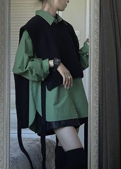 This stylish outfit features a bold green oversized shirt paired with a black sleeveless sweater, adding a modern twist to a classic look. The black leather skirt and knee-high boots complement the ensemble, while the chunky watch and rings add a touch of edginess. Perfect for making a statement while staying effortlessly chic. chic dress to impress   #fashion #girlyoutfit #summergirlyoutfit #dresstoimpress #chicdresstoimpress #dresstoimpresscoronation #dresstoimpressregencyera #amusementparkdresstoimpress #datenightdresstoimpress #outfitsforsummer #outfitinspocasual #outfitinsposummer #dresstoimpresscodes #dresstoimpressideas #dresstoimpresscombos Knit Waistcoat, Green Shirts, Patchwork Knit, Black Shawl, Elegante Casual, Easy Trendy Outfits, Comfortable Room, Modest Fashion Outfits, 가을 패션