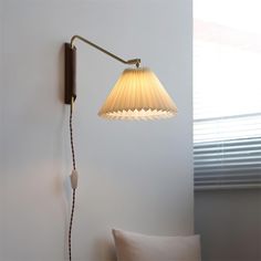 a lamp that is on the side of a wall