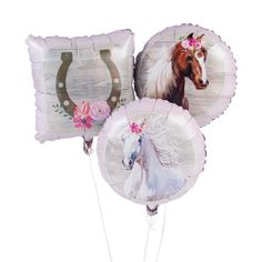 three balloons with horses and flowers on them