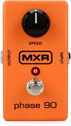 an orange guitar pedal with the words mxtr on it's front panel