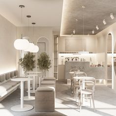 an empty restaurant with white tables and chairs