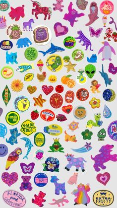 an assortment of colorful stickers on a white surface