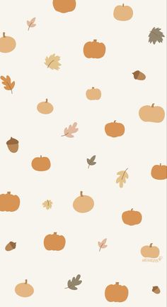 an autumn background with pumpkins, leaves and acorns