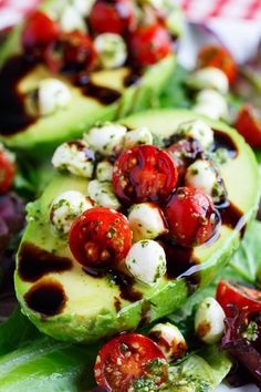 avocado salad with cherry tomatoes and mozzarella dressing on top, ready to be eaten