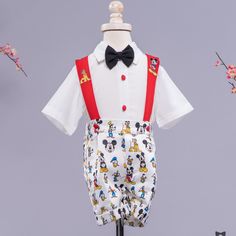 The Mickey Mouse Inspired Suspenders Set is a high-quality dressy outfit for boys. Our suspenders sets are made with as much attention to detail and luxurious fabric as gentlemen's suits. ⦁ button down shirt, shorts, suspenders, bow tie⦁ 0-6 months - 5 years. Can be custom made up to size 12 years. Don't see what you need?CUSTOM ORDERS - If your desired size is not available, please select "custom" from the selection above and add the item to your cart. Enter the size you'd like in the "Order No Red Suspenders, Dressy Outfit, Suspenders Set, Black Bow Tie, Short Sleeve Dress Shirt, Red Button, Pleated Shorts, Dressy Outfits, Itty Bitty