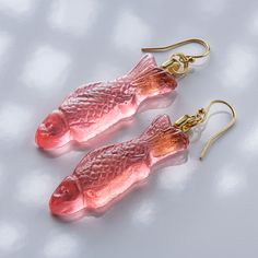 They look absolutely identical to Swedish Fish Gummy Candy, but they are hand crafted from Glass! Designed and created by Artist, and Head Designer of Local Art Glass, Evan Burnette, These earrings are a fun, playful, and an avant-garde fashion statement. They come in 18 karat gold, some available in Argentium Silver. Current Flavors: Grape, Pineapple, Strawberry, Lime, Mystery Flavor, Peach, Watermelon, Pink Lemonade, Blue Raspberry, Tangerine *Return Policy We have very high-quality standards, however when things get busy something might slip by. If you receive something in which you feel might be a manufacturers error, please contact us immediately with a photo and we will either immediately send you a replacement or issue a full refund.  If you wish to make a return over a matter of ae Fish Accessories Jewelry, Gold Fish Earrings, Fish Earrings Gold, Gummy Fish, Enamel Fish-shaped Jewelry As Gift, Gold Fish-shaped Earrings, Pineapple Strawberry, Strawberry Lime, Swedish Fish