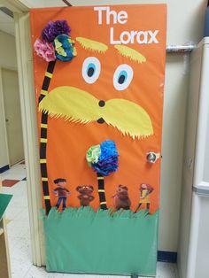 the lorax door is decorated with paper flowers