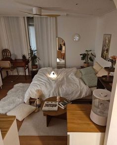 a bed sitting in the middle of a living room