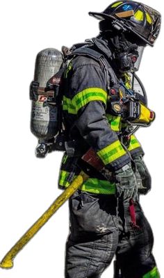 a fireman in full gear holding a large yellow stick and helmet on his back