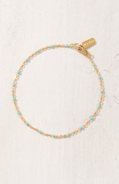 Round enamel beads intersperse bits of color on this delicate chain bracelet handcrafted from 14-karat-gold fill. 7" length Lobster clasp closure 14k-gold fill/enamel Made in the USA Elegant Turquoise Beaded Chain Bracelet, Station Bracelet, Handmade Chain, On Set, Chain Bracelet, Lobster Clasp, Gold Filled, Nordstrom, Turquoise