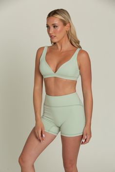 Our Pastel Green Bralette will be your go-to for everyday comfort. This plunging V-cut neckline bralette features removable padding for customizable support and is hardware-free for a seamless fit. Crafted from buttery soft fabric, it offers a luxurious feel against your skin. Perfect for lounging or layering, this comfortable and stylish bralette will quickly become a staple in your wardrobe. Fitted Triangle Top Sports Bra With Removable Pads, Low-cut Sports Bra With Removable Pads, Solid Color Seamless Triangle Top Sports Bra, Seamless Solid Color Triangle Top Sports Bra, Seamless Triangle Top Sports Bra In Solid Color, Seamless Triangle Top Sports Bra, Solid Color Low-cut Seamless Bra, Solid Color Seamless Low-cut Bra, Triangle Top Sports Bra With Removable Pads