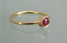 14k Gold Ruby Ring With Polished Finish, Gold Ruby Birthstone Ring With Bezel Setting, Ruby Ring With Polished Finish In 14k Gold, Minimalist Ruby Ring Birthstone, Minimalist Ruby Ring With Birthstone, Ruby Birthstone Ring With Polished Finish, Elegant Stackable Yellow Gold Ruby Ring, Elegant Yellow Gold Stackable Ruby Ring, Elegant Stackable Ruby Ring In Yellow Gold