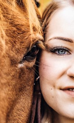 a close up of a person and a horse