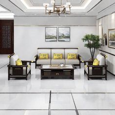 a living room filled with furniture and a chandelier