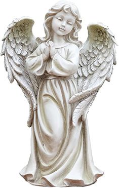 a statue of an angel holding a bird