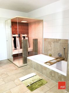 a bath room with a large tub and a walk in shower