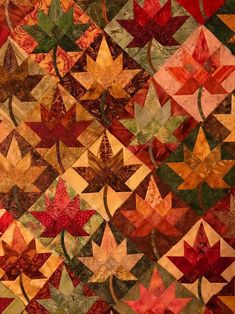 an image of a quilt made with autumn leaves