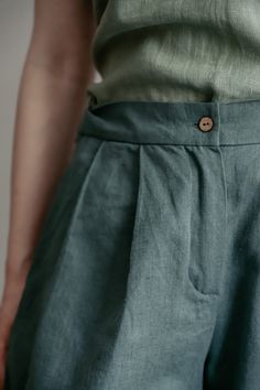 "Smart shorts being cut from lightweight, they work so well for balmy outside days. The shorts are designed to have a high-rise waist and pleats along the front that enhance the loose, breezy fit. Surely the garment is tailored with in-seam pockets that are an indispensable element of any practical apparel. The waistband is equipped with a shirr to better fit in shape. Such an up-to-date classic cut looks splendid with tops optionally covered with a jacket or you can create an astonishing combin Grad Outfits, Smart Shorts, Buy Linen, Shorts High Waisted, Handmade Wardrobe, Shorts For Women, Organic Linens, Linen Shorts, Shorts With Pockets