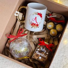 a coffee mug and some chocolates in a box