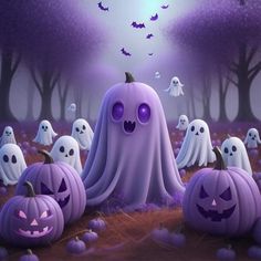 a group of halloween pumpkins with ghost faces on them