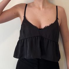 Gently Worn, Essentially In Brand New Condition. Very Cute, Versatile Tank That Can Be Dressed Up Or Down! Black Ruffle Camisole Top, Black Ruffled Camisole Top, Black Ruffle Cami Top, Black Ruffled Cami Top, Black Cami Tank Top With Ruffles, Black Ruffled Cami Tank Top, Chic Black Ruffled Camisole, Black Ruffled Spaghetti Strap Tops, Black Ruffled Camisole With Spaghetti Straps