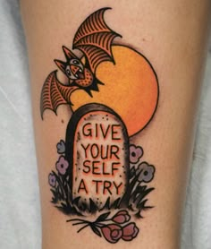 a tattoo that says give your self a try with a bat on top of a tombstone