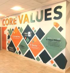 the entrance to core value is decorated with colorful tiles