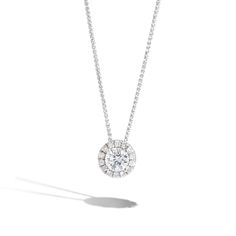 An elegant .33ct round diamond adorned with a paved diamond halo, weighing a total of .50tw. The pendant hangs on a beautiful 14K white gold dainty chain. Classic White Halo Diamond Necklace, White Halo Diamond Necklace, Classic Diamond White Halo Necklace, White Halo Diamond Necklace With Round Pendant, Diamond White Necklace With Halo Pendant, Round Diamond Halo, Verragio Engagement Rings, Cuban Link Necklace, Halo Necklace