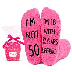 pink slippers with i'm not the boss written on them next to a bag