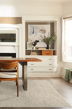 a dining room with a table and chairs