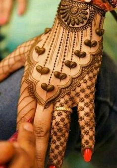 a woman's hand with henna on it and the caption that says,