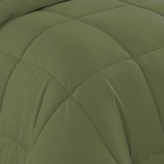 the comforter is made up with green sheets