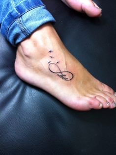 a person with a tattoo on their foot