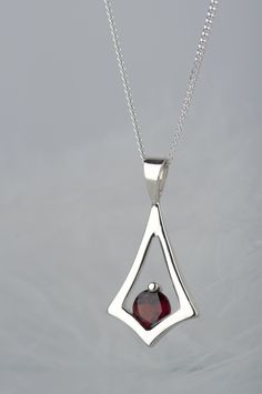 Are you looking for dainty jewelry for a person who likes minimalist design? Here is a garnet necklace in a geometric shape - subtle but still noticeable because of beautiful deep red color of the stone. It can be a gift for many occasions - especially for birthday, because garnet is January birthstone (and also Capricorn stone). In my workshop I have also garnets in other colors - pink rhodolite and orange spessartine. If you wish me to set one of them instead of red bohemian garnet please cont Handwritten Jewelry, Necklace Gift Ideas, Metalsmithing Jewelry, Stacked Necklaces, Silver Jewelry Design, Garnet Necklace, January Birthstone, Silver Jewelry Handmade, Amulets