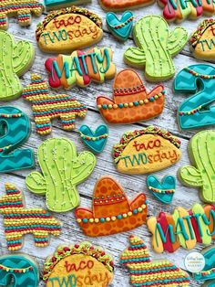 some decorated cookies are sitting on a table