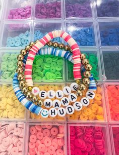 the beaded name bracelets are organized in plastic containers