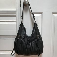 Love The Tassels On This Sexy Adrienne Vittadini Hobo Shoulder Bag! Gorgeous Thick, Soft Leather, Metal Zipper, Fun Side Zip Pockets W/ Tassels. Purchased During My Everything-Black-Leather, Bad Girl Phase: Used Lightly, Looks Brand New. Elastic Front Pocket W/ Magnetic Closure Perfect For Yr Phone. Silver O-Rings, Rivet Accents, Internal Zipped Pocket And Fabric Pockets. Zippers Can Be A Little Sticky. No Scratches Or Imperfections. Adrienne Vittadini Hobo Purse Material: Leather Color: Black Black Hobo Bag, Slouchy Hobo Bag, Oatmeal Sweater, Leather Hobo Bags, Leather Hobo Handbags, Leather Clutch Purse, Hot Bags, Hobo Shoulder Bag, Hobo Purse