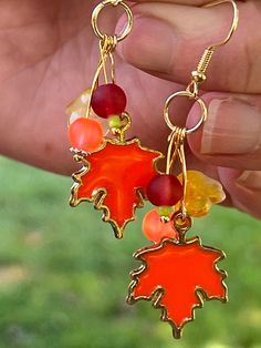 Loving the change to Fall? -Celebrate with these maple leaf and fall color themed beads. We use quality materials to handcraft our earrings- no plastic nor acrylic! Handmade Dangle Jewelry For Fall, Fall Season Gift Dangle Earrings, Autumn Jewelry, Pride Jewellery, Awareness Jewelry, Fall Fest, Lampwork Earring, Nature Earrings, Pumpkin Earrings