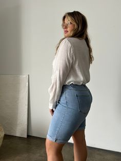 Comfortable and modest, the Plus Size Cuffed Bermuda Denim Shorts are easy to throw on with a t-shirt or blouse for a casual outfit. Grab your favorite sneakers and a cute tote and you'll be ready to head to the beach or run some errands. These shorts feature cuffed bottom hems that are sewn in place, five functional pockets and 5 belt loops, a zipper fly, and a single button closure. The material is a very stretchy denim. These shorts are made from 88% cotton, 8% polyester, and 4% spandex. Mach Bermuda Denim Shorts, Casual Outfit, Denim Shorts, Dark Blue, The Beach, Light Blue, Casual Outfits, Cuff, Spandex