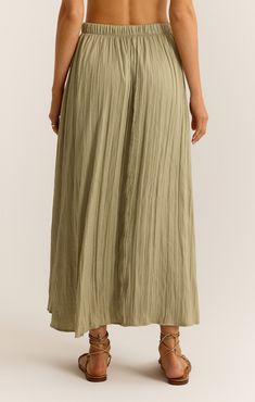 You're going to fall in love with this flowy midi skirt. The elastic waistband makes it so easy to wear and the crinkle fabric adds a slight sheen that sets it apart. Bohemian Midi-length Spring Bottoms, Bohemian Midi Length Spring Bottoms, Flowy Midi Length Bottoms For Day Out, Casual Pleated Midi Bottoms, Flowy Summer Midi-length Bottoms, Relaxed Rayon Skirt For Vacation, Rayon Midi Pleated Skirt, Vacation Rayon Lined Skirt Bottoms, Rayon Pleated Midi Skirt