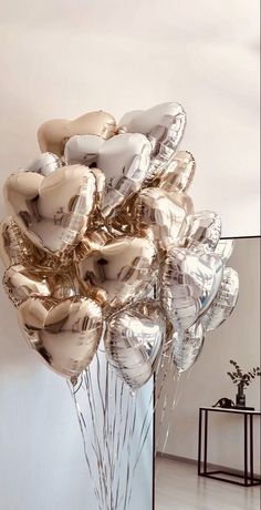 a bunch of balloons that are sitting in a vase