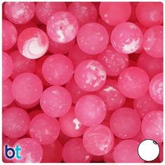 some pink balls with white dots on them