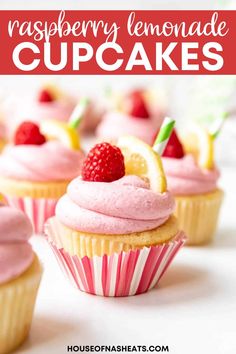 raspberry lemonade cupcakes with pink frosting and fresh strawberries on top