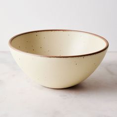 a white bowl sitting on top of a table