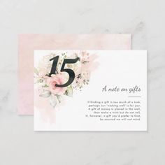 a card with the number five on it and flowers in pink, white and black