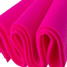 pink yoga mat rolled up on top of each other