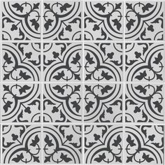 a black and white tile pattern with an ornate design in the center, on a gray background