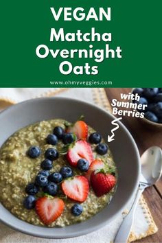 a bowl filled with oatmeal topped with strawberries and blueberries